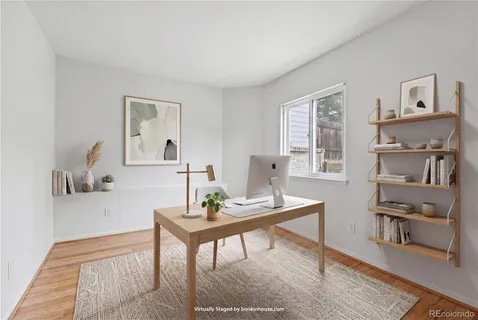 a view of a workspace with furniture