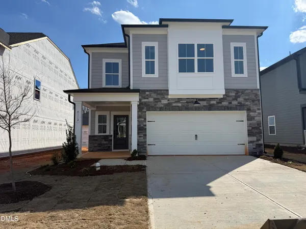 a view of a house with large windows