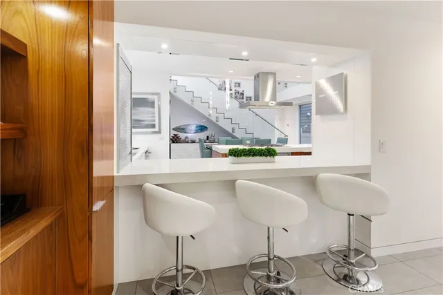 a living room with table and chairs