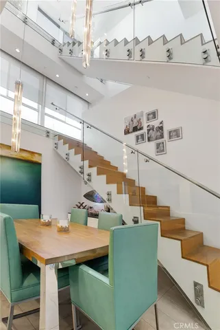 a view of a room with furniture and wooden floor