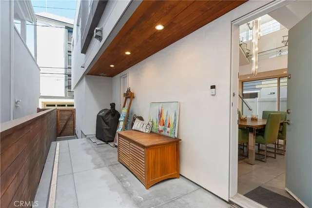 a view of a hallway with seating area