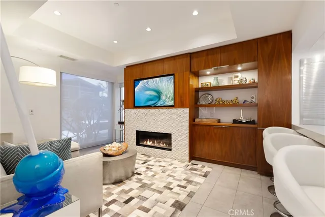 a living room with furniture a rug and a fireplace