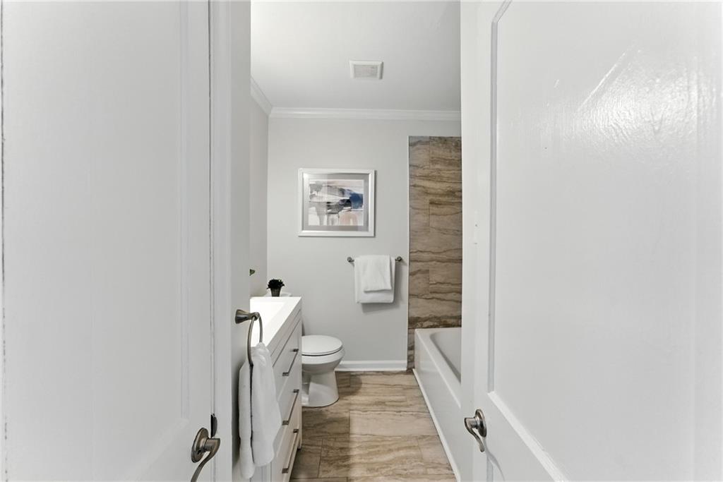 1411 Mercer Avenue Atlanta, GA 30337 - Photo 16 of 21 a bathroom with a toilet