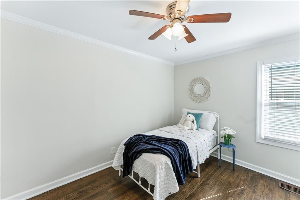 1411 Mercer Avenue Atlanta, GA 30337 - Photo 18 of 21 a bedroom with a bed and a window