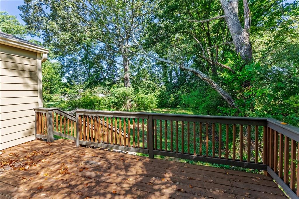 1411 Mercer Avenue Atlanta, GA 30337 - Photo 21 of 21 a balcony with wooden floor and fence