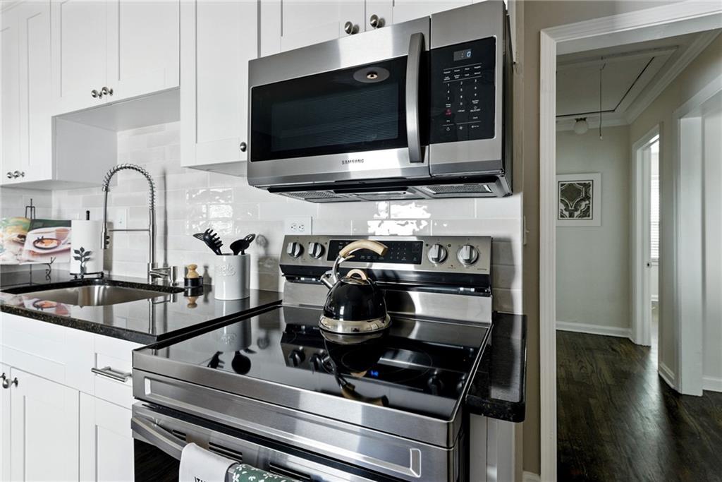 1411 Mercer Avenue Atlanta, GA 30337 - Photo 6 of 21 a kitchen with a stove and a microwave