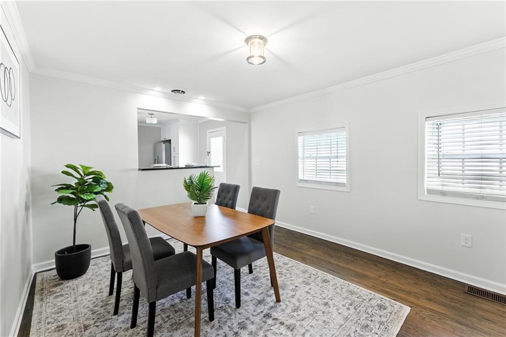 1411 Mercer Avenue Atlanta, GA 30337 - Photo 10 of 21 a view of a dining room with a table and chairs