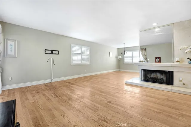 a spacious bedroom with a bed and a fireplace