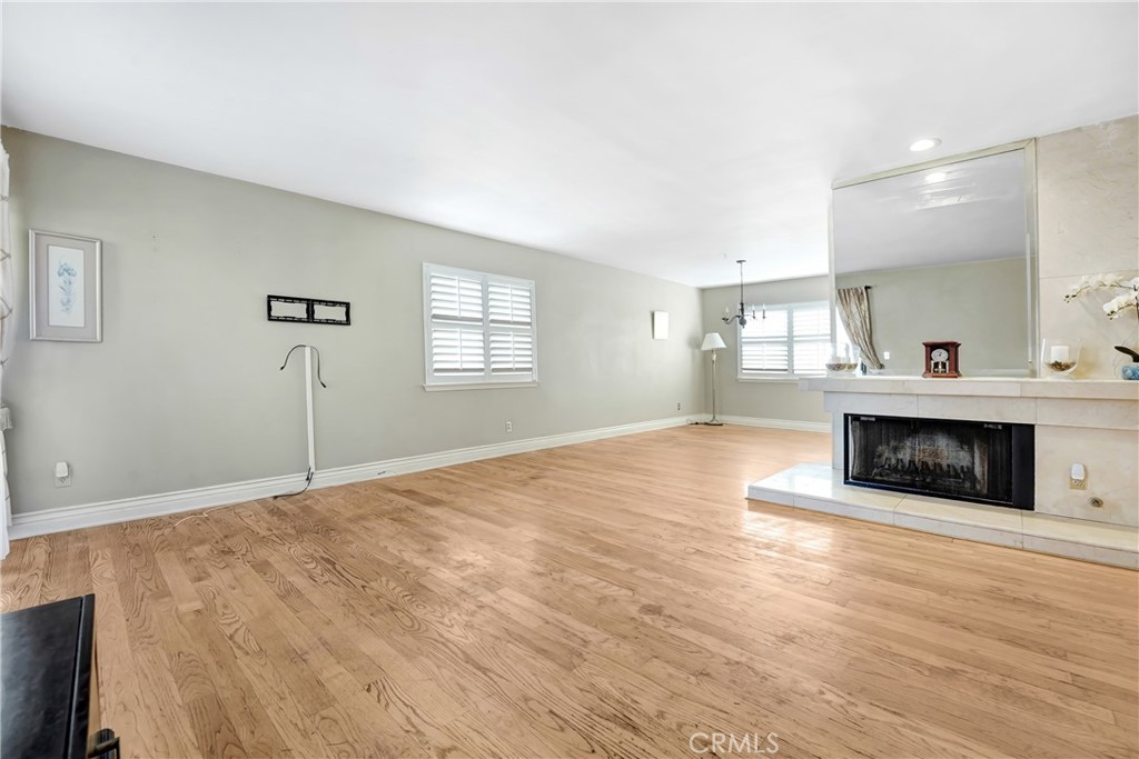 5514 Las Virgenes Road Calabasas, CA 91302 - Photo 3 of 20 a spacious bedroom with a bed and a fireplace