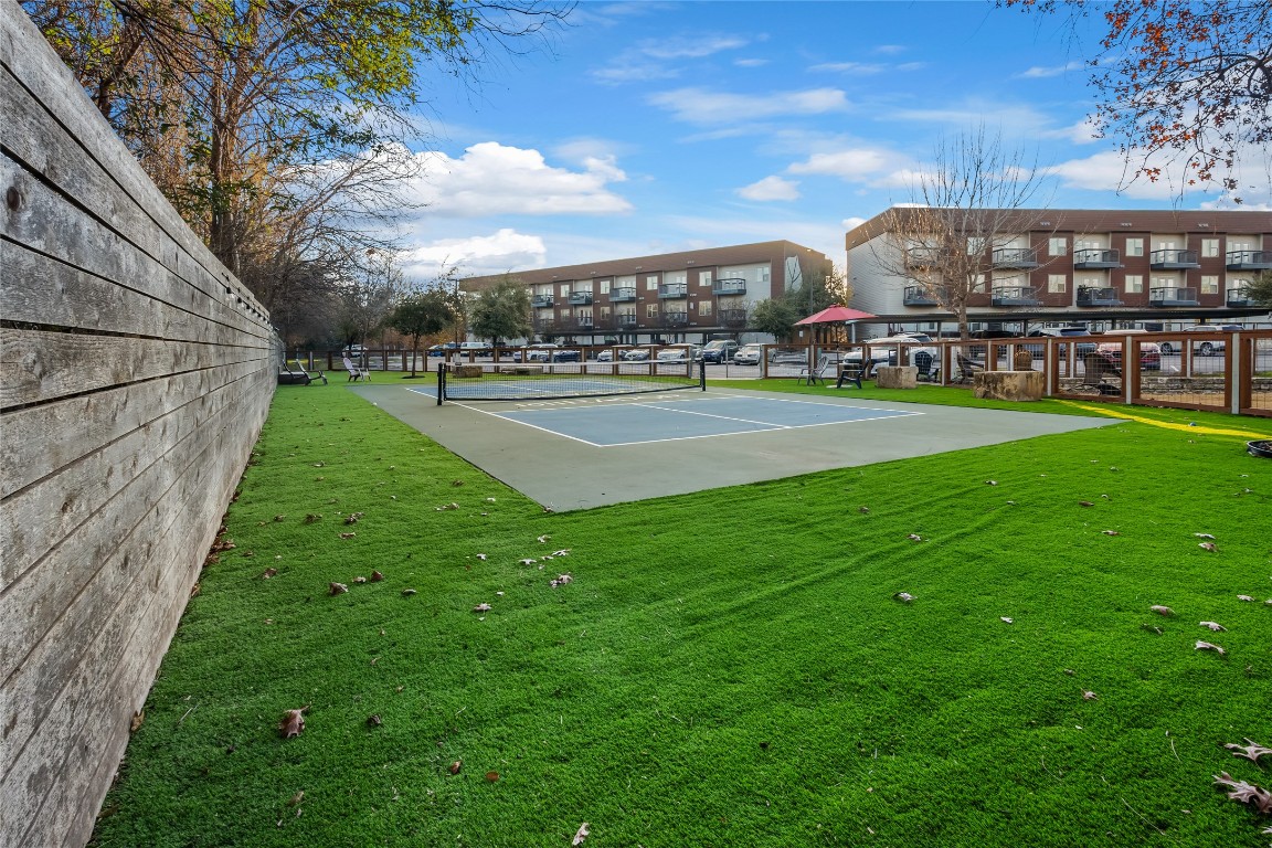 2505 Thornton Road, Unit 1202 Austin, TX 78704 - Photo 20 of 21 View of pickle ball court with a lawn and fence