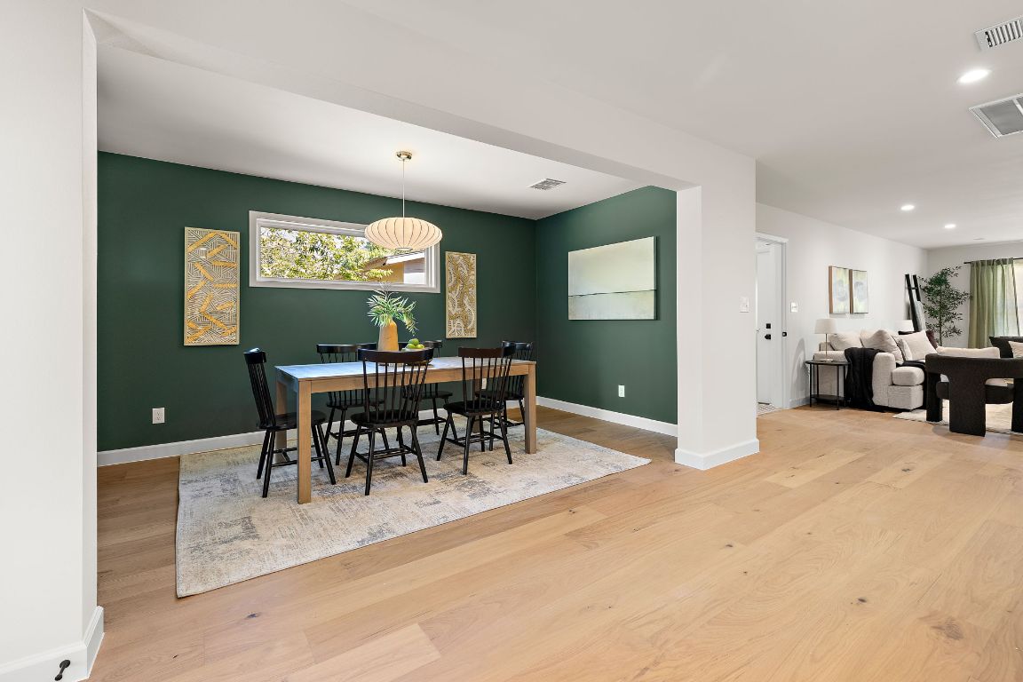 8102 Burrell Drive Austin, TX 78757 - Photo 14 of 31 a view of a a dining room with furniture and a chandelier