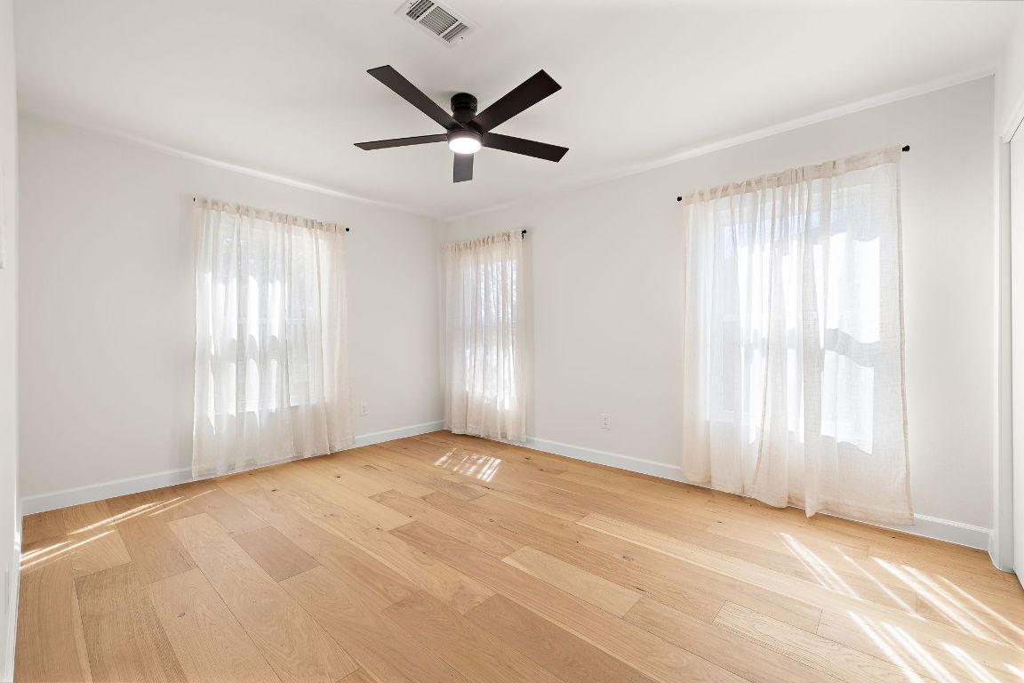 8102 Burrell Drive Austin, TX 78757 - Photo 20 of 31 a view of a livingroom with a ceiling fan and window