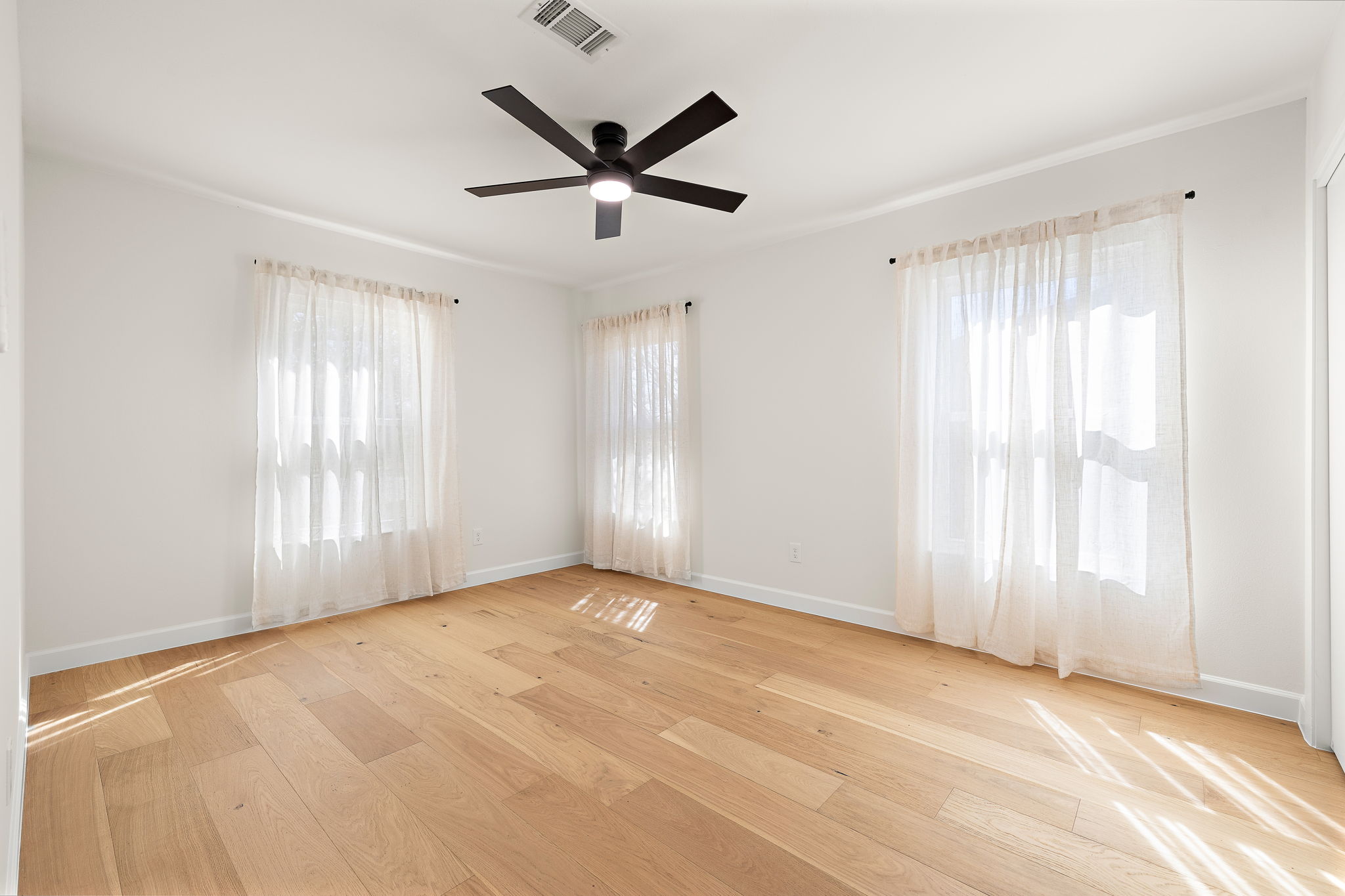 8102 Burrell Drive Austin, TX 78757 - Photo 20 of 31 a view of a livingroom with a ceiling fan and window