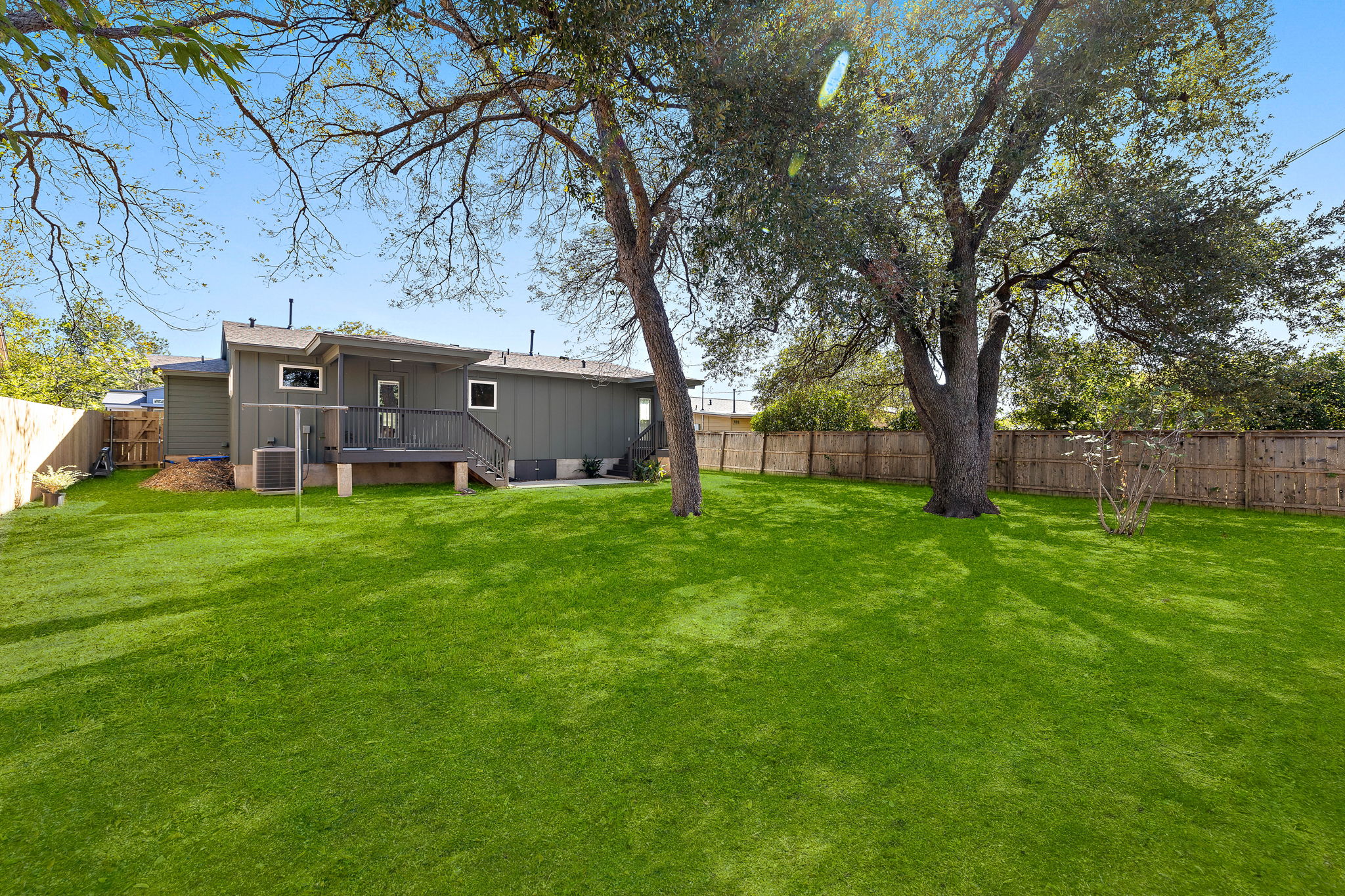 8102 Burrell Drive Austin, TX 78757 - Photo 30 of 31 a view of a house with a back yard