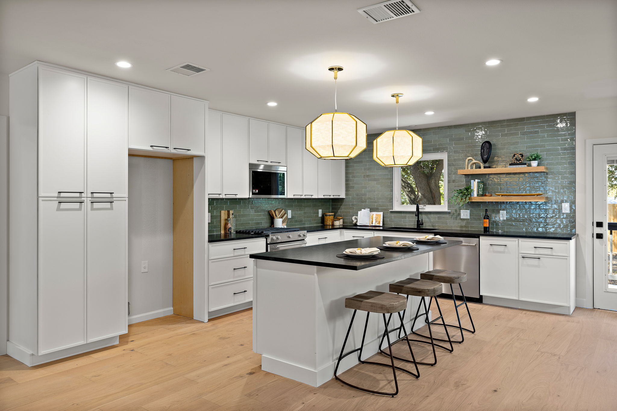 8102 Burrell Drive Austin, TX 78757 - Photo 8 of 31 a kitchen with a sink a counter top stainless steel appliances and cabinets