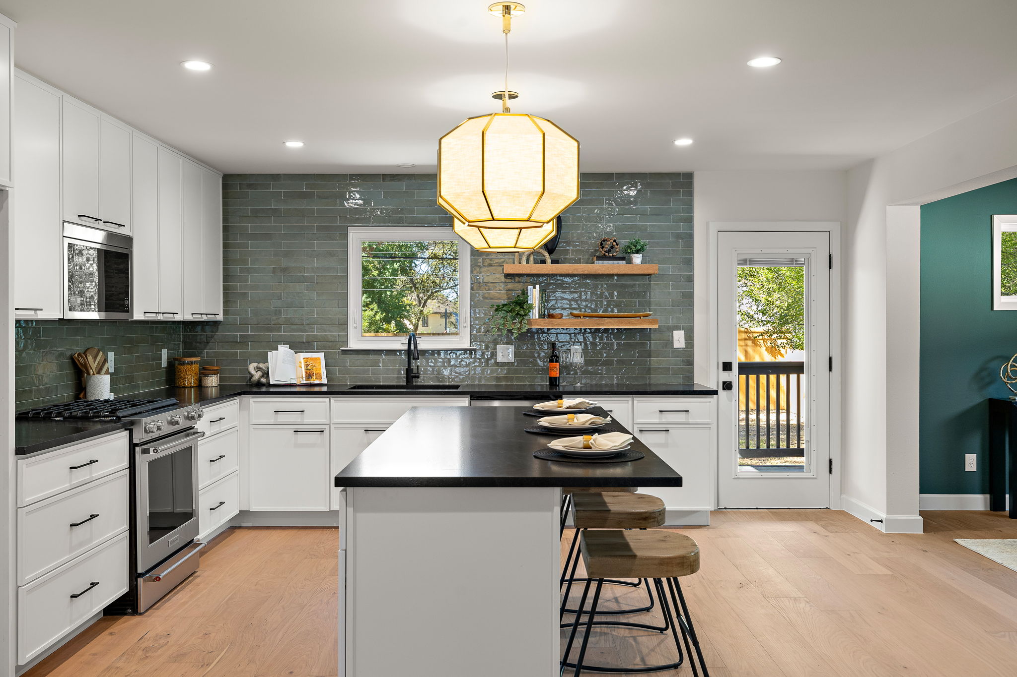 8102 Burrell Drive Austin, TX 78757 - Photo 9 of 31 a kitchen with sink cabinets and window