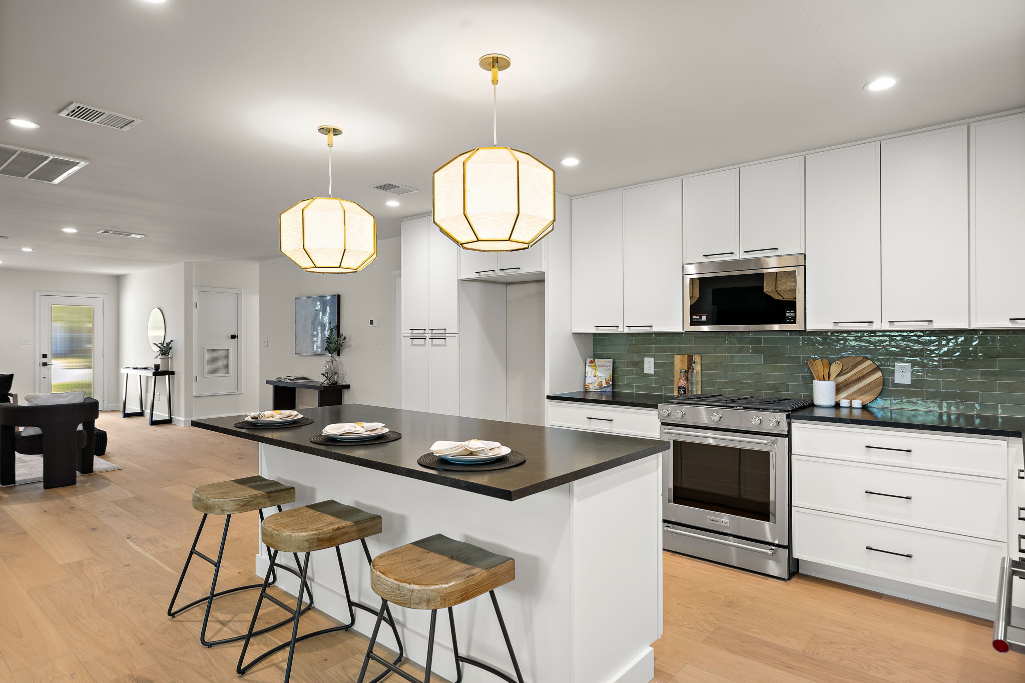 8102 Burrell Drive Austin, TX 78757 - Photo 10 of 31 a kitchen with granite countertop a stove a oven a dining table and chairs
