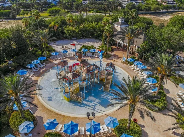 an aerial view of a house with garden space and lake view