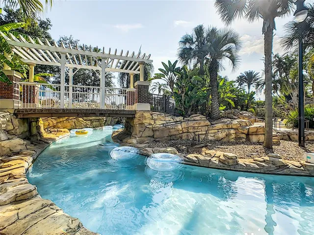 a view of a swimming pool with a patio