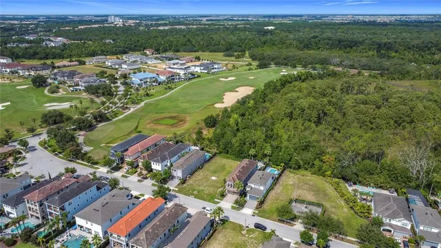 an aerial view of residential houses with outdoor space