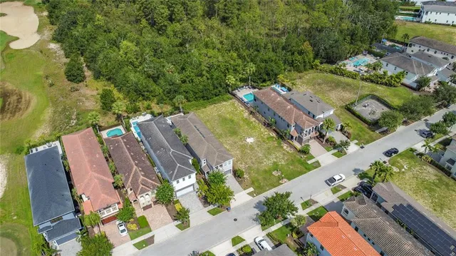 an aerial view of a residential houses with outdoor space