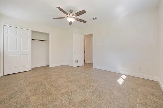 an empty room with a bathroom