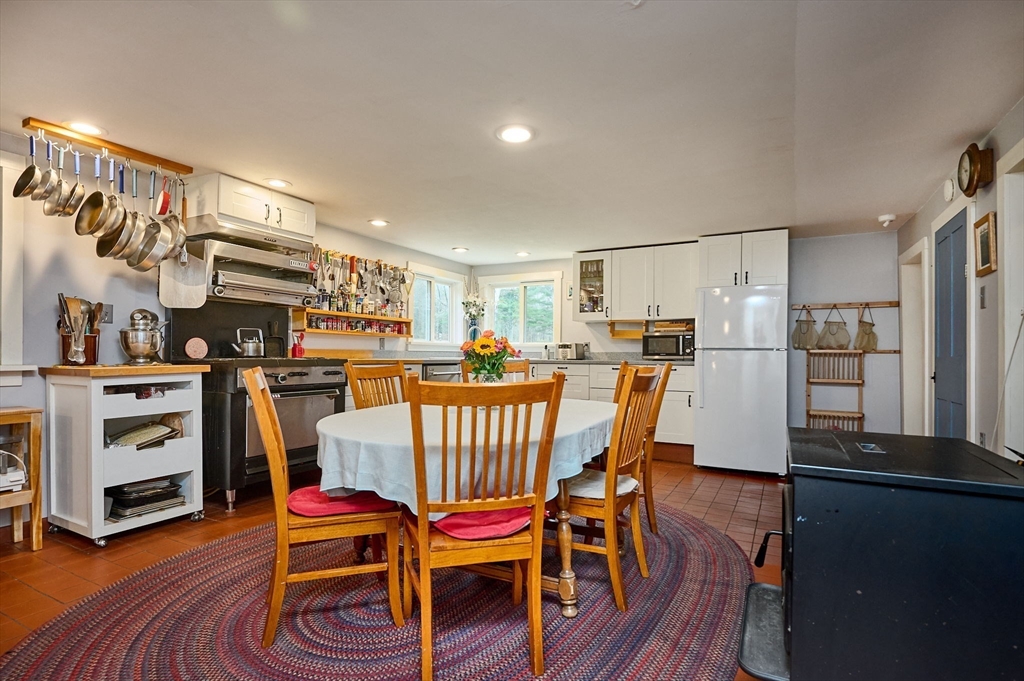 10 Maple Street Plainfield, MA 01070 - Photo 14 of 42 a dining room with furniture and wooden floor