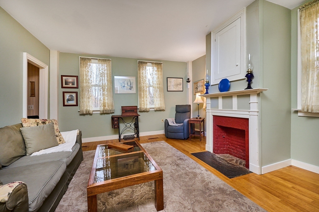 10 Maple Street Plainfield, MA 01070 - Photo 15 of 42 a living room with furniture and a fireplace