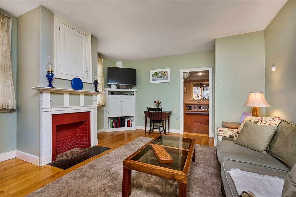 10 Maple Street Plainfield, MA 01070 - Photo 17 of 42 a living room with furniture and a fireplace