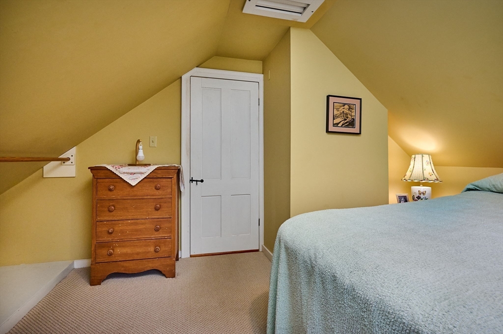 10 Maple Street Plainfield, MA 01070 - Photo 26 of 42 a bedroom with a bed and furniture