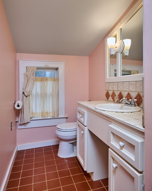 10 Maple Street Plainfield, MA 01070 - Photo 29 of 42 a bathroom with a sink a toilet and a mirror