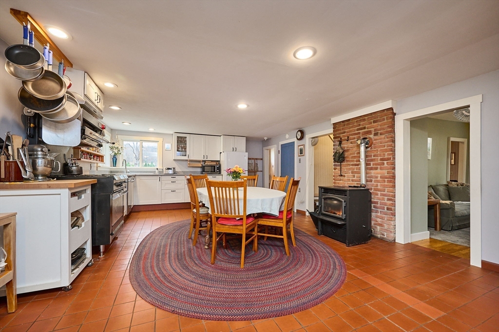 10 Maple Street Plainfield, MA 01070 - Photo 8 of 42 a living room with furniture a dining table and kitchen view