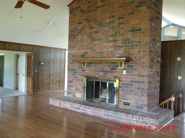 3221 James Stone Road Cedar Hill, TN 37032 - Photo 4 of 20 Look at the floor to ceiling brick fireplace.