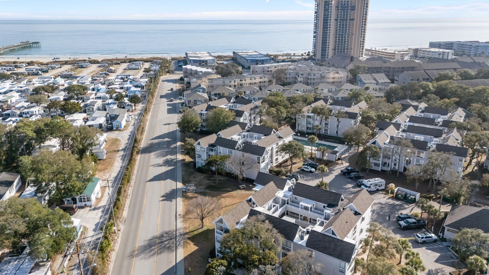 351 Lake Arrowhead Road, Unit 211 Myrtle Beach, SC 29572 - Photo 33 of 40 Aerial view of property and surrounding area with a nearby body of water