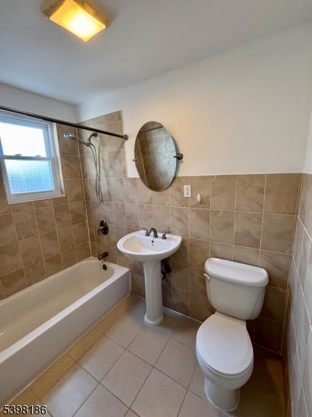 145 Brighton Avenue Belleville, NJ 07109 - Photo 12 of 15 a bathroom with a toilet a sink and bathtub