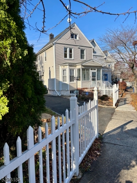 145 Brighton Avenue Belleville, NJ 07109 - Photo 2 of 15 a front view of house with yard and green space