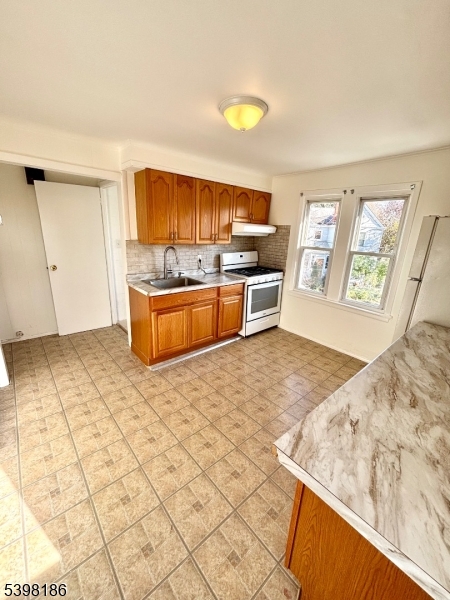 145 Brighton Avenue Belleville, NJ 07109 - Photo 3 of 15 a view of kitchen with wooden cabinets