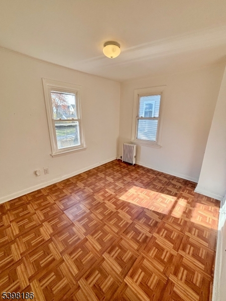 145 Brighton Avenue Belleville, NJ 07109 - Photo 6 of 15 a view of empty room with wooden floor