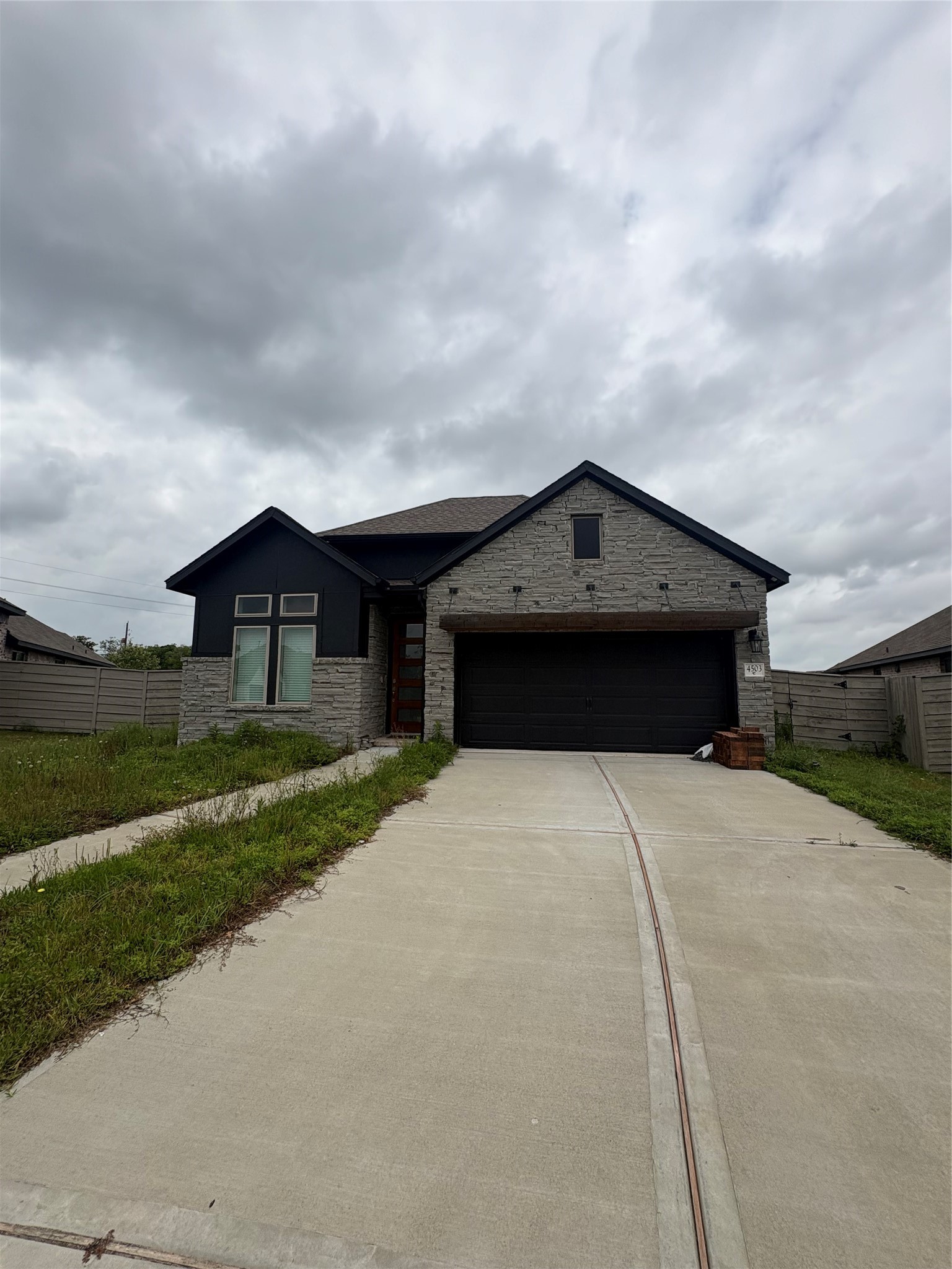 4503 Cedar Butte Lane Manvel, TX 77578 - Photo 2 of 16 Long driveway with garage door opener.