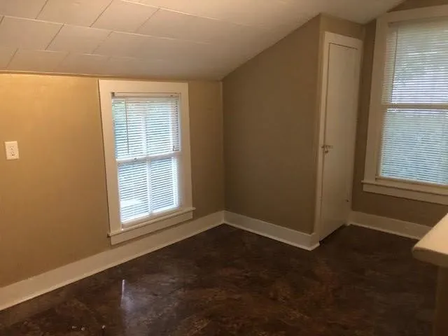 an empty room with windows