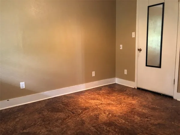 an empty room with a door