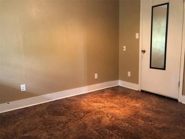 an empty room with a door