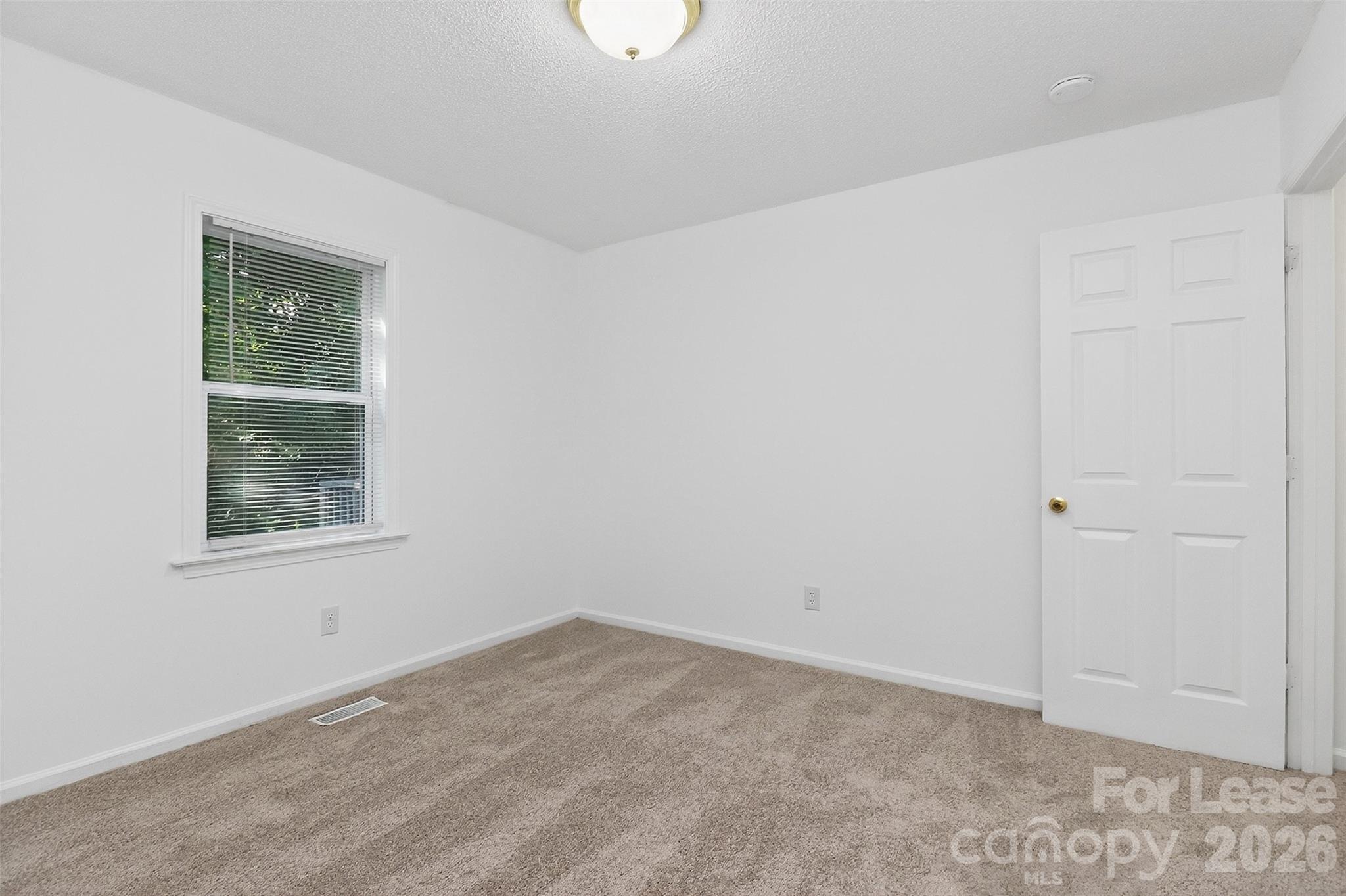 91-93 Sunderland Road Southwest, Unit 93 Concord, NC 28027 - Photo 18 of 30 an empty room with a window