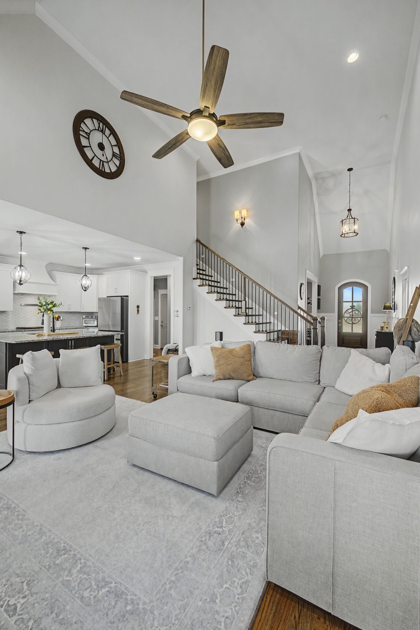 2965 Stewart Campbell Pointe Spring Hill, TN 37174 - Photo 11 of 48 a living room with furniture and a clock