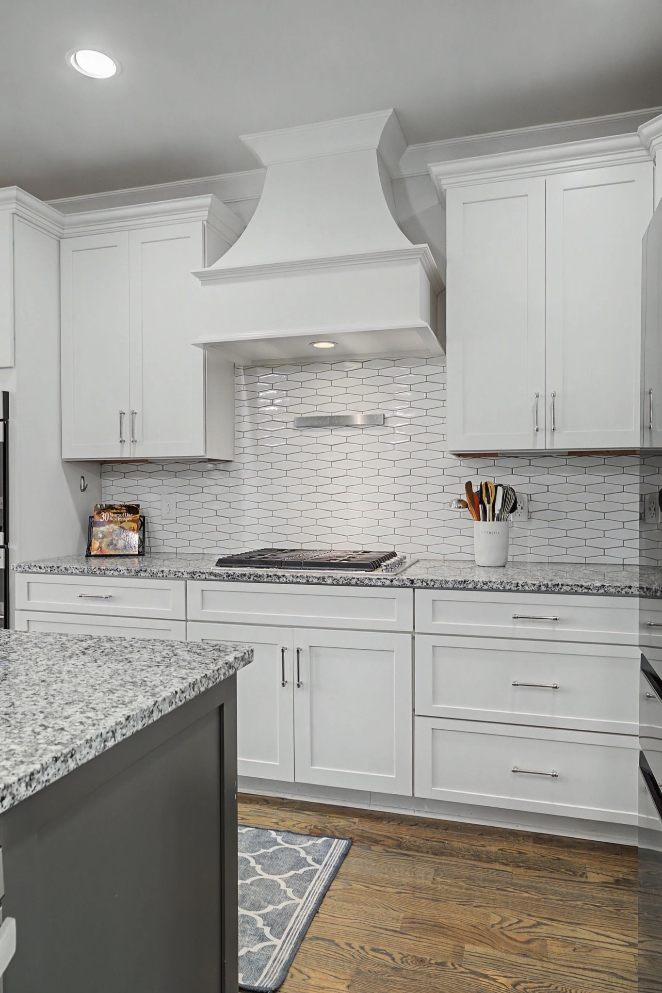 2965 Stewart Campbell Pointe Spring Hill, TN 37174 - Photo 15 of 48 a kitchen with granite countertop white cabinets and a stove