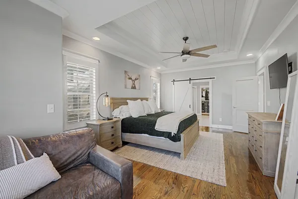 a bathroom with a granite countertop sink vanity and mirror