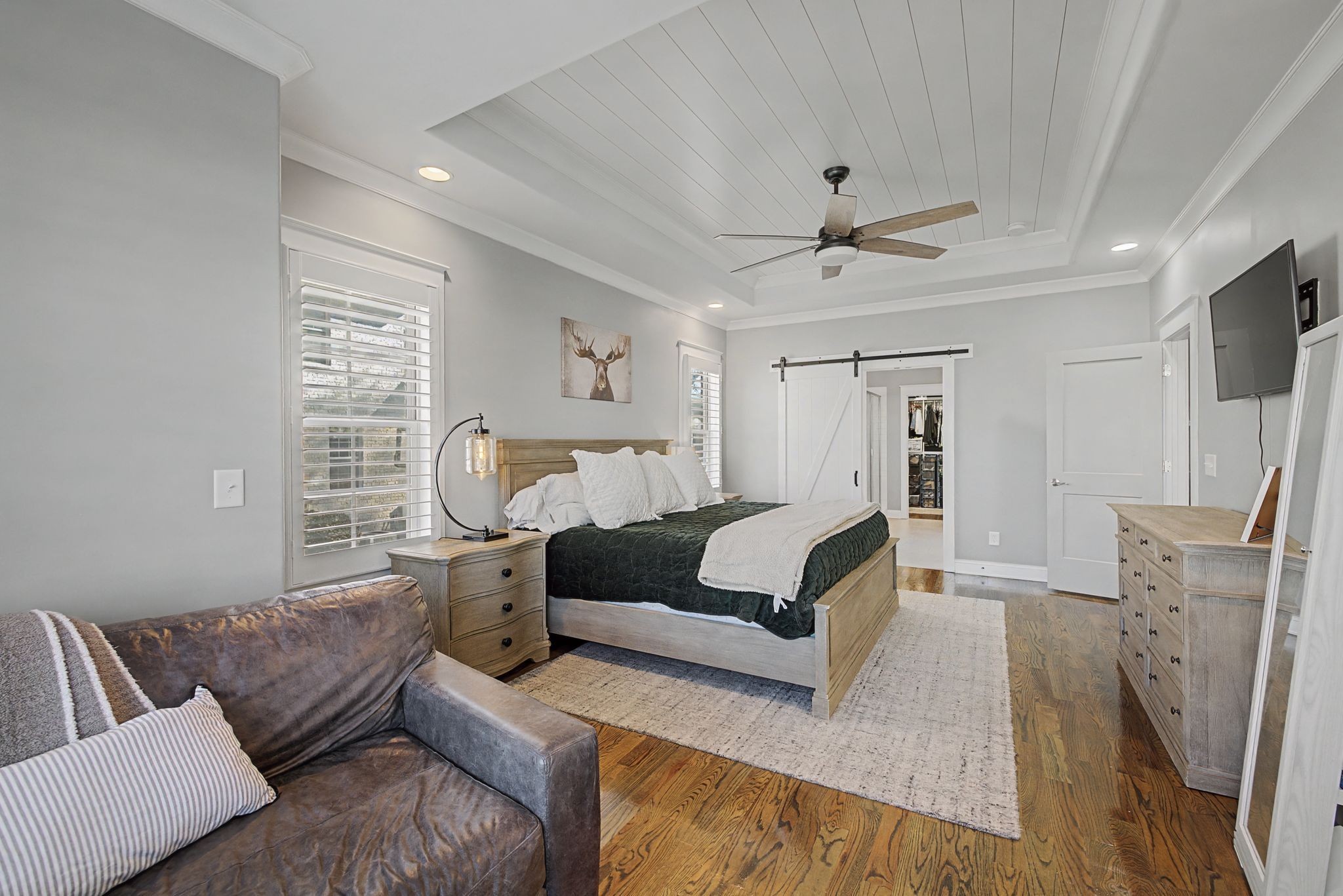 2965 Stewart Campbell Pointe Spring Hill, TN 37174 - Photo 19 of 48 a bedroom with furniture and a fireplace