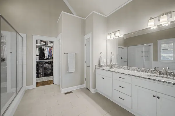 a white bath tub sitting in a bathroom next to a window
