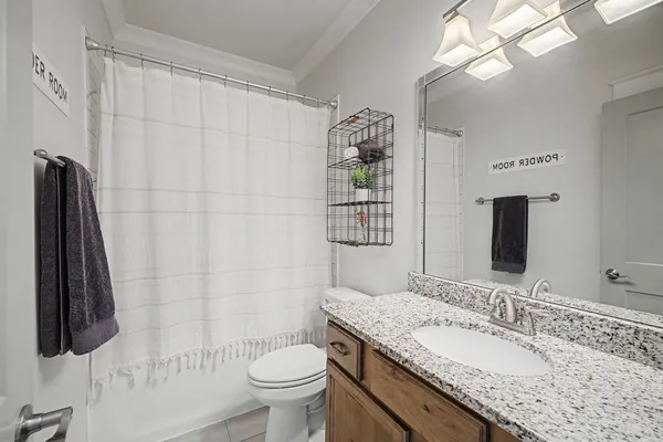 a view of a hallway with wooden floor and cabinet