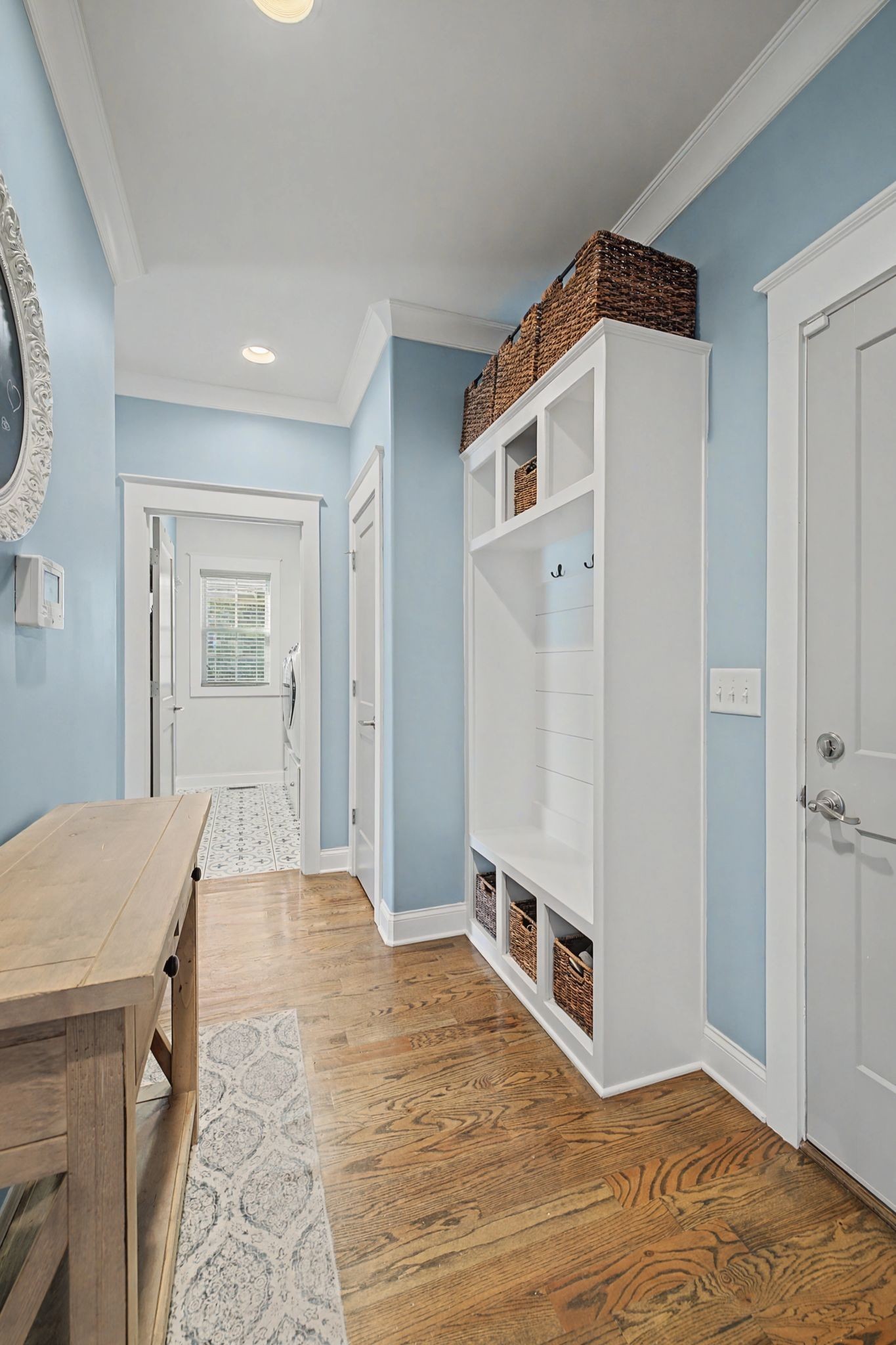 2965 Stewart Campbell Pointe Spring Hill, TN 37174 - Photo 27 of 48 a view of a hallway with wooden floor and cabinet
